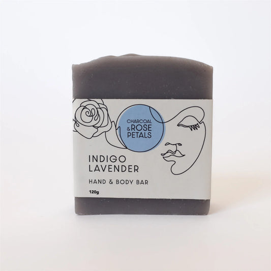 Charcoal & Rose Petals Indigo Lavender hand and body bar with a label on a white background