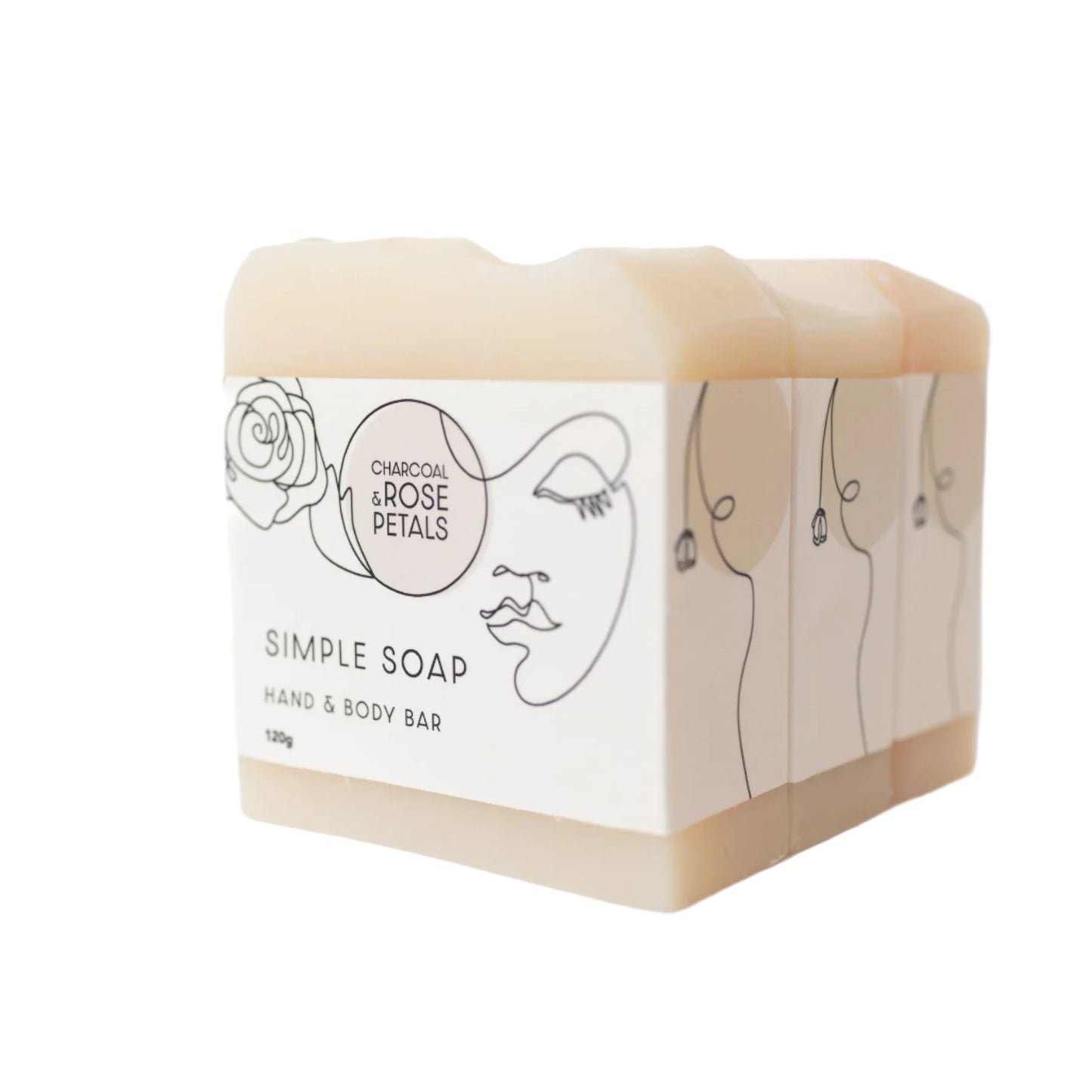 A bar of hand soap with 'Charcoal & Rose Petals' written on the packaging, indicating it is a simple soap bar for hand and body use.
