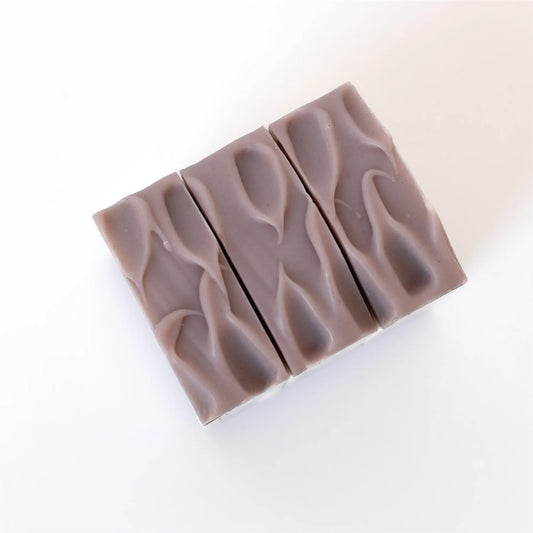 A top view of the lavender eucalyptus natural bar soap, showcasing the wavy design.