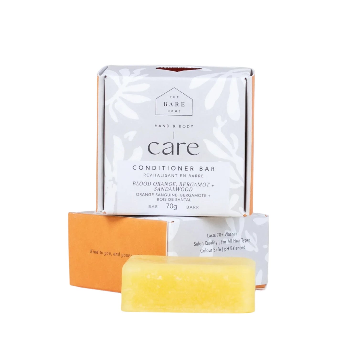 The image shows a rectangular conditioner bar along with its packaging. The packaging is labeled 'CARE' and indicates that it is a conditioner bar in the scent blood orange, bergamot and sandalwood.