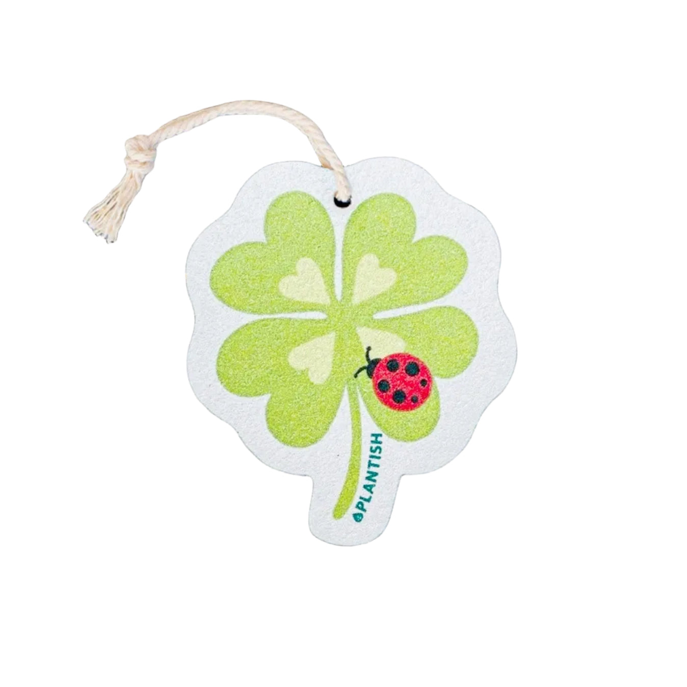 Four-leaf clover-shaped plantable tag with a ladybug on a textured gray background
