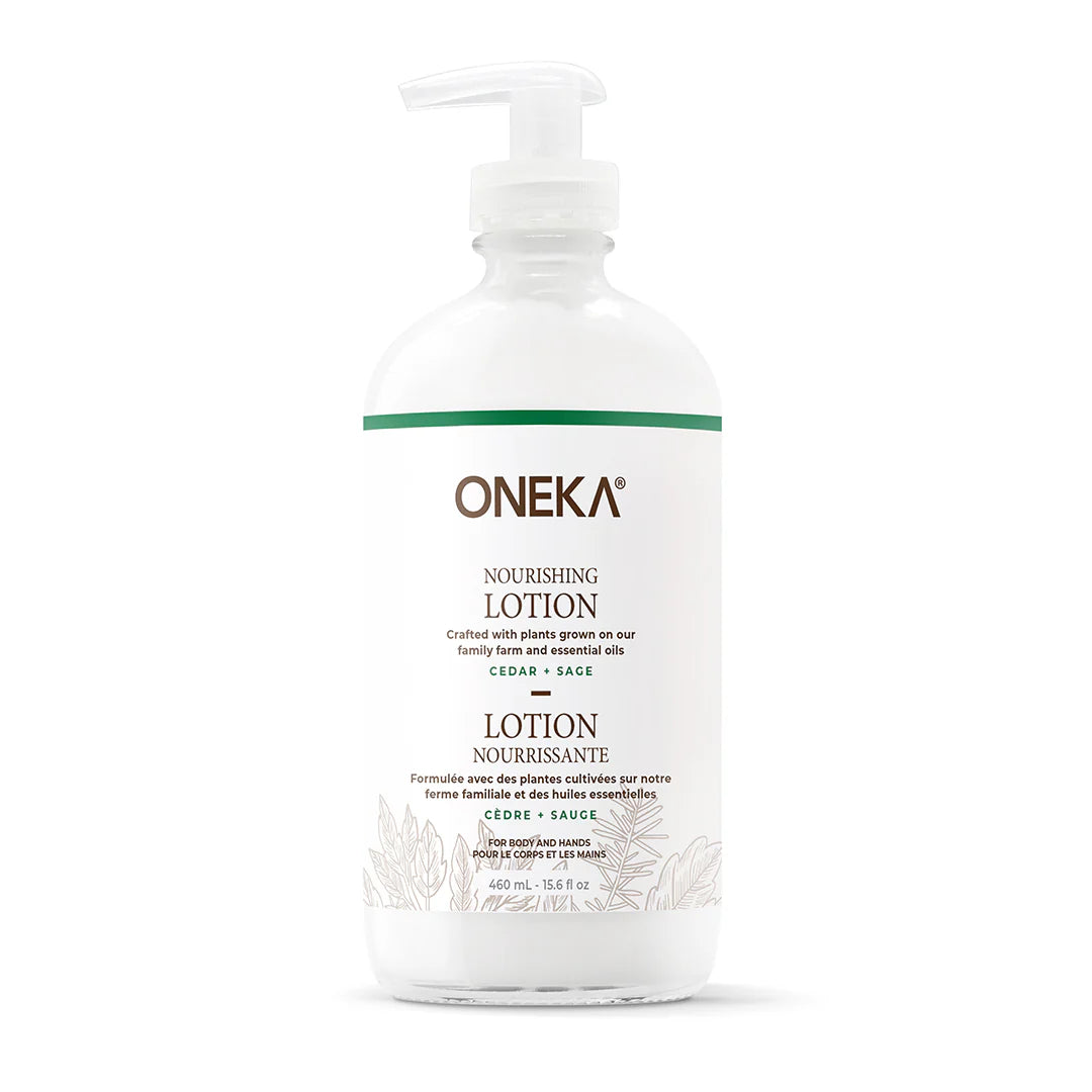 A pump bottle of Oneka Nourishing Lotion with Cedar & Sage label, indicating that it is plant-based and organic.