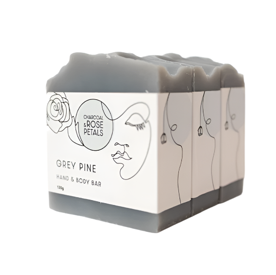 Three bars of grey pine hand & body soap with 'Charcoal & Rose Petals' branding, stacked vertically with a white label design featuring a sketch of a woman's face and a rose.