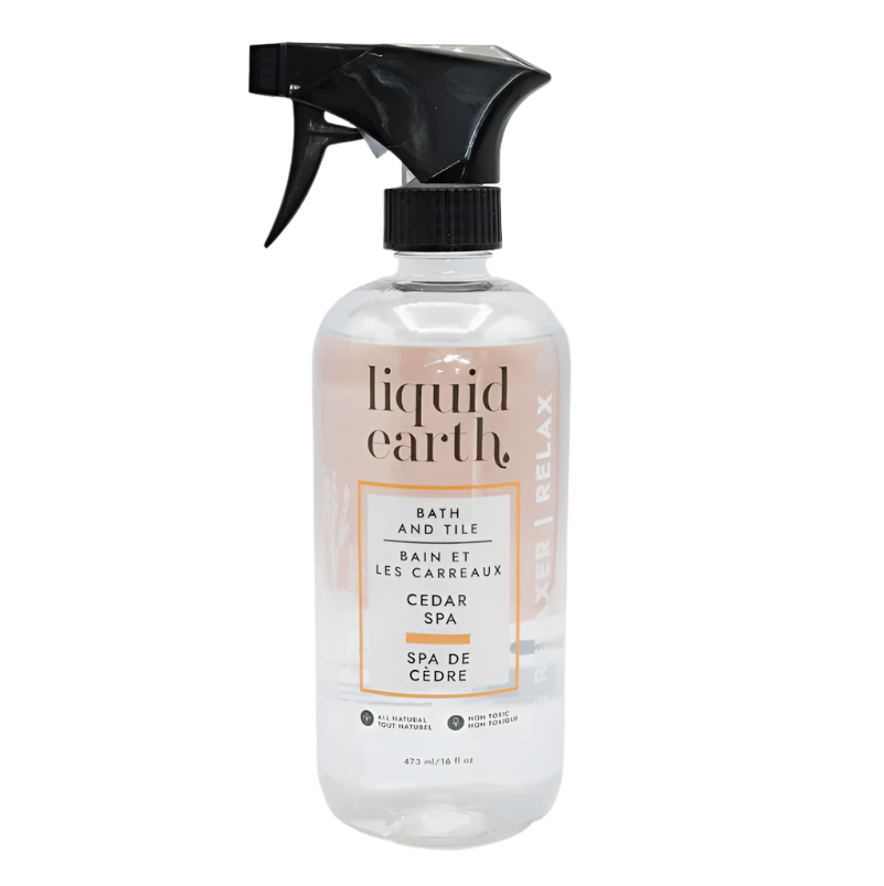 A glass bottle of Liquid Earth bath and tile cleaner with a label that reads 'cedar and tile relaxing spa blend'. The label also indicates this product is all natural and non-toxic.