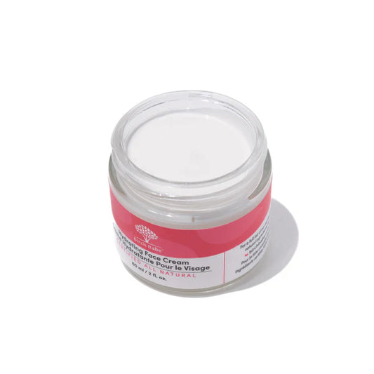 A jar of Birch Babe hydrating face cream without the lid, showing the smooth, white consistency of the cream.