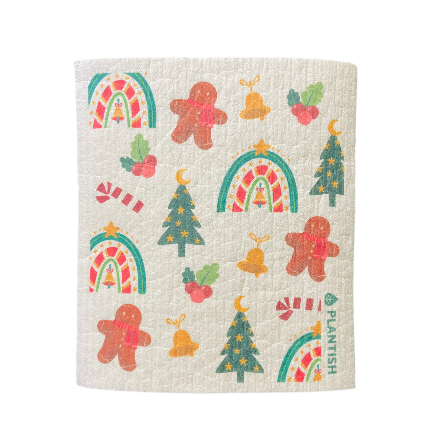 A holiday edition white swedish sponge cloth with small festive designs on it including gingerbread men, christmas trees, and gold bells.