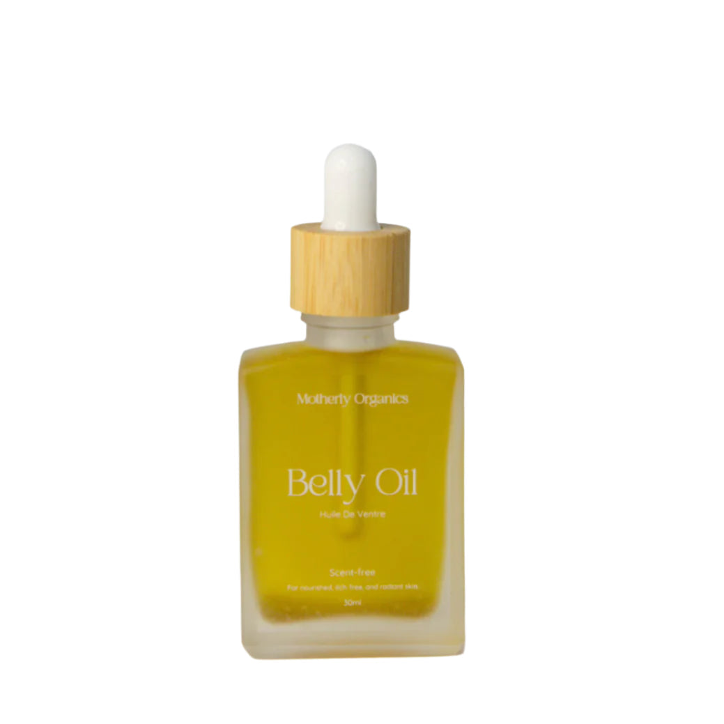 A glass bottle with wooden dropper containing Motherly Organics belly oil on a white background.