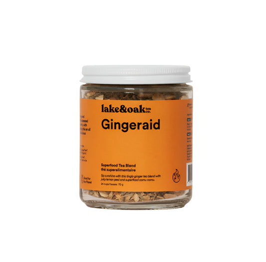 A glass jar of Lake and Oak 'Gingeraid' organic ginger tea blend on a white background.